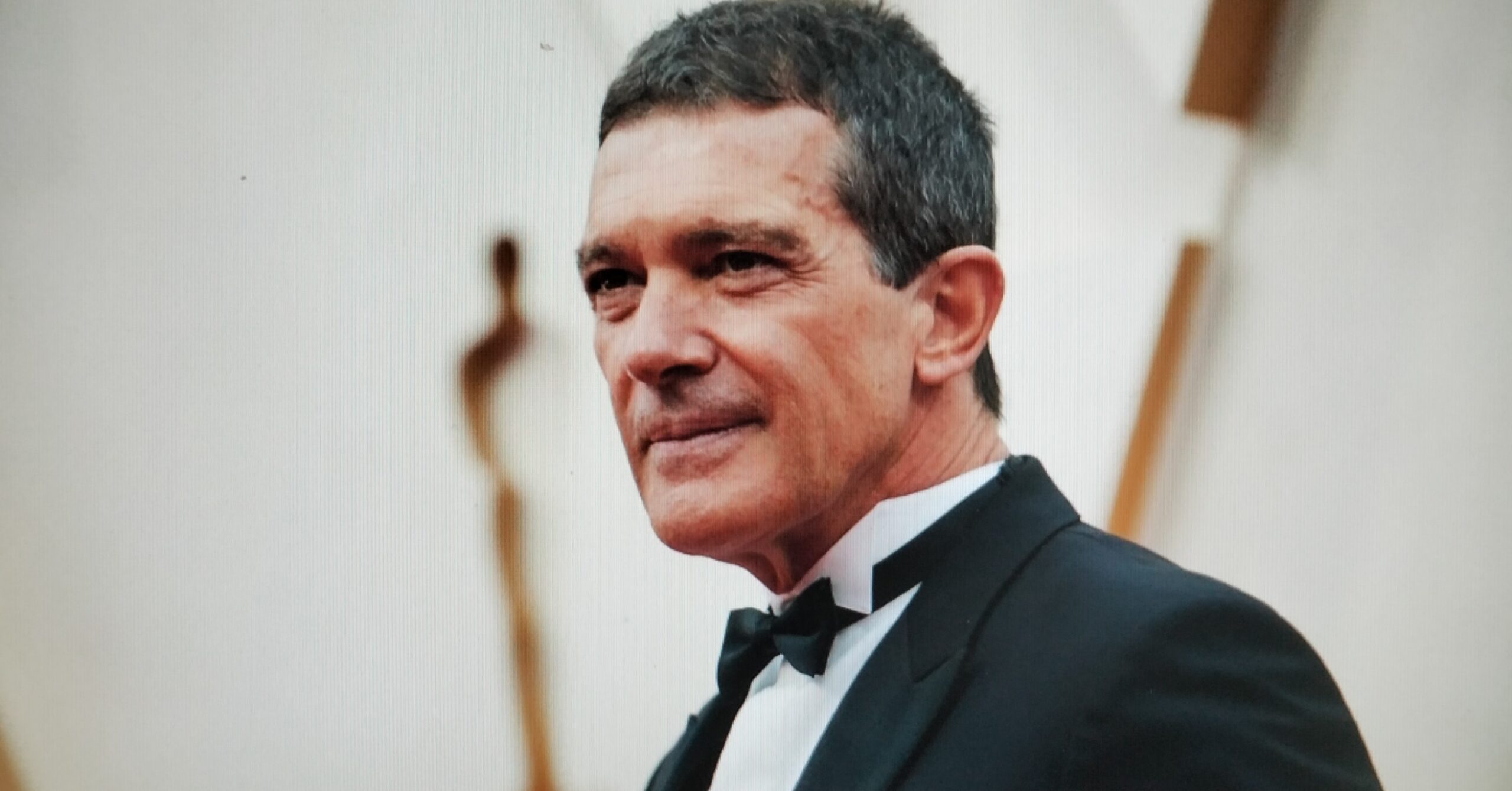 A portrait of actor Antonio Banderas in a tuxedo.