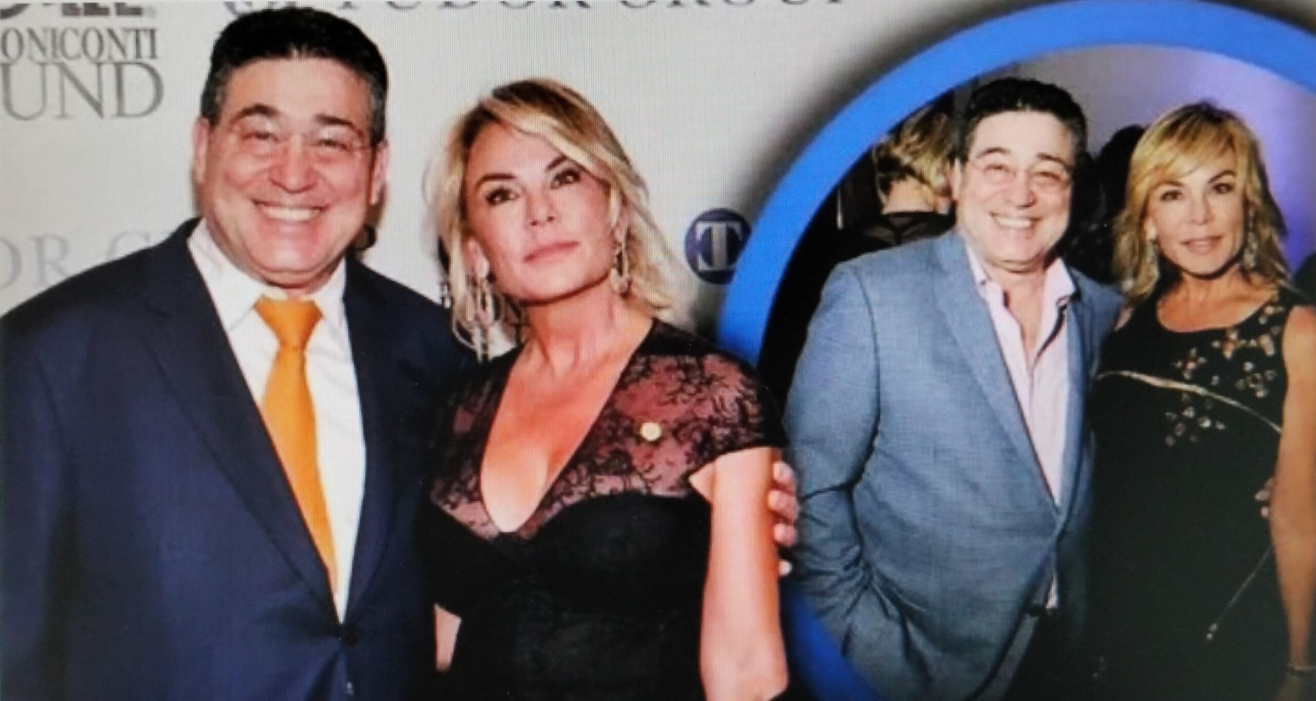 A group of celebrities posing on a red carpet.