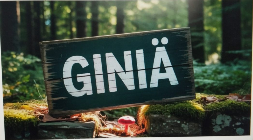 A wooden sign in a forest that reads "GINIÄ" in white letters.
